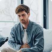 Woman massaging wrist which is in obvious pain